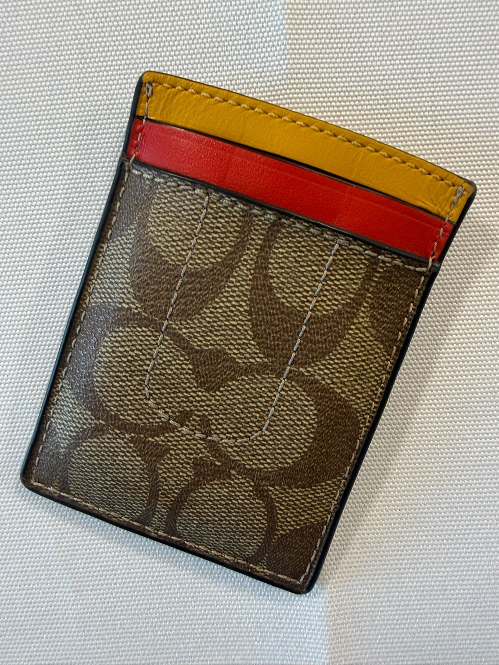 Coach Brown Signature Canvas Card Holder with Yellow and Red Trim